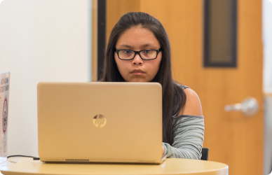 Student on laptop taking an online learning class