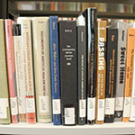 Photo of books in the Barber Library stacks