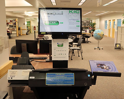 KIC scanner by the Reference Desk in Barber Library