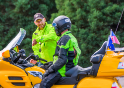 instructor and motorcycle student in yellow