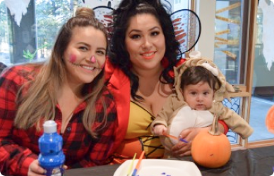 COCC employee enjoying halloween decorating with her children