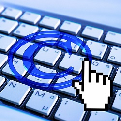 Stock photo of a copyright symbol superimposed over a computer keyboard