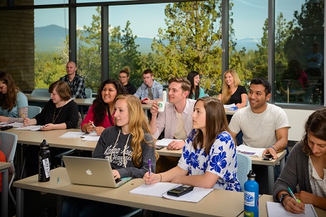 Photograph of a full COCC classroom in session with enthusiastic students
